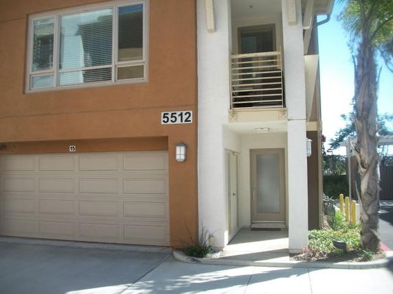 Front view of a house with a double garage and an entrance.