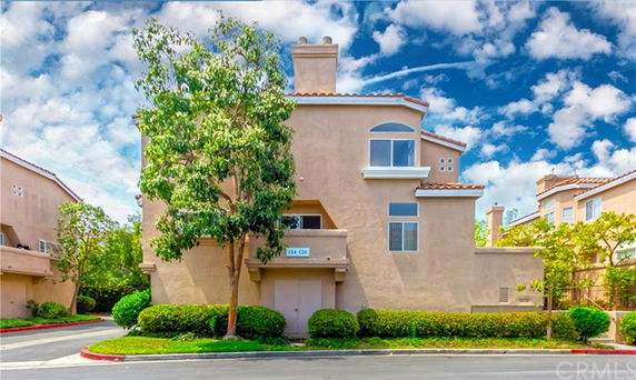 Front view of a modern multi-story townhouse.