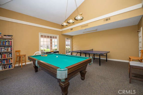 Recreation room with a pool table and ping pong table.