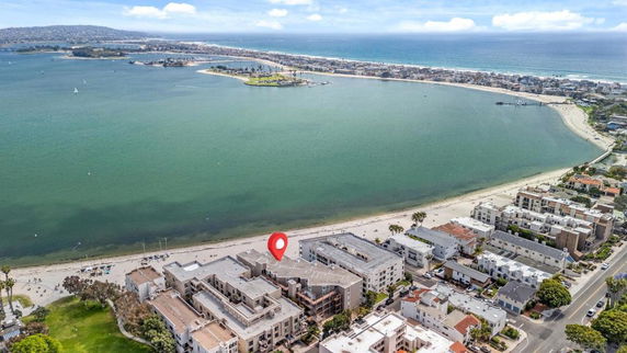 Panoramic view of a coastal area with buildings and a beach.