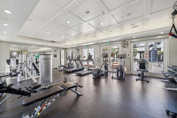 Interior view of a gym with various exercise equipment