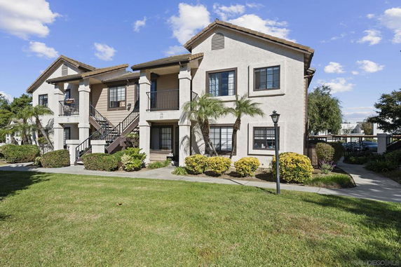 Front view of a two-story residential building with multiple units.