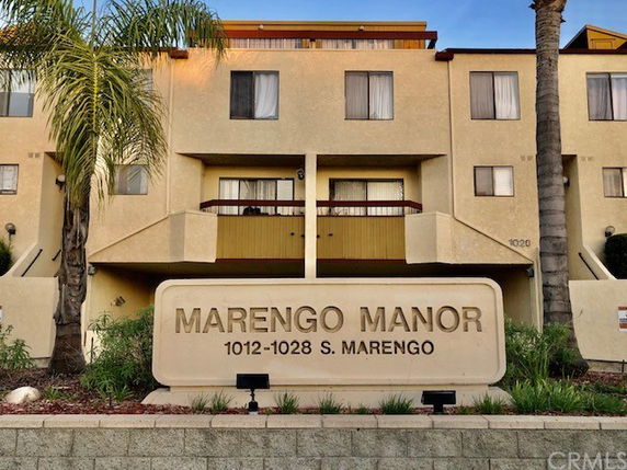 Front view of a multi-story building named Marengo Manor.