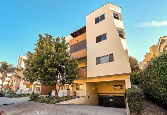 Front view of a modern multi-story apartment building