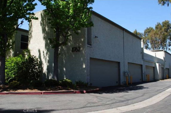 Front view of a building with multiple garages.