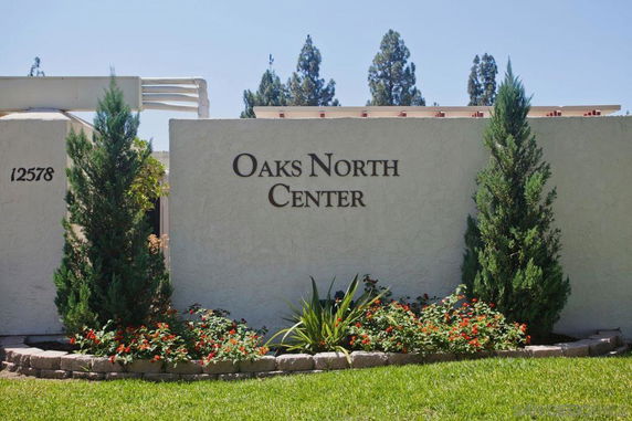 Front view of a building entrance with signage reading 'Oaks North Center'.