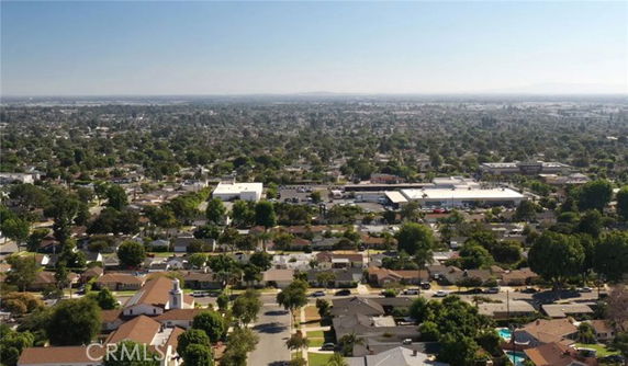 Panoramic view of a suburban area with numerous houses and trees.