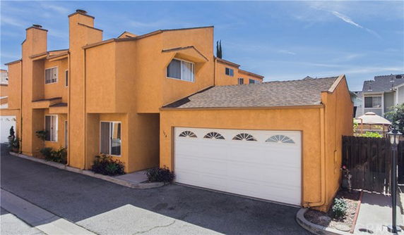 Front view of a two-story house with a double garage.