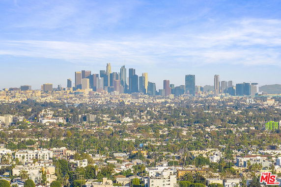 Wide-angle view of a city skyline with numerous high-rise buildings.
