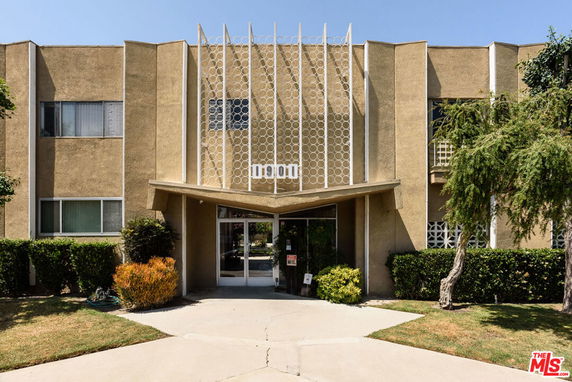 Front view of a building with decorative facade and entrance.