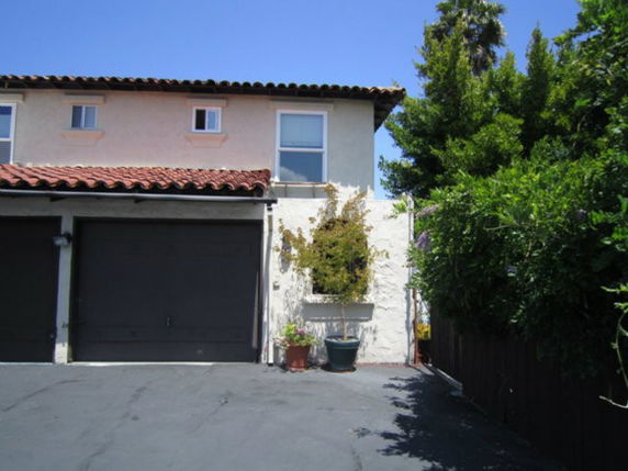 Front view of a two-story house with a double garage.
