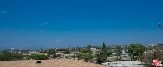 Wide angle view of the cityscape and rooftops.