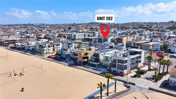 Aerial view of beachfront properties with a designated unit marked.