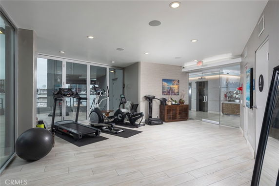 Indoor gym area with exercise equipment including treadmill and stationary bike.