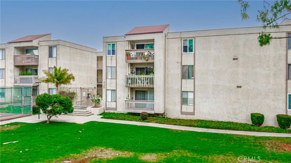 Front view of an apartment building with balconies.