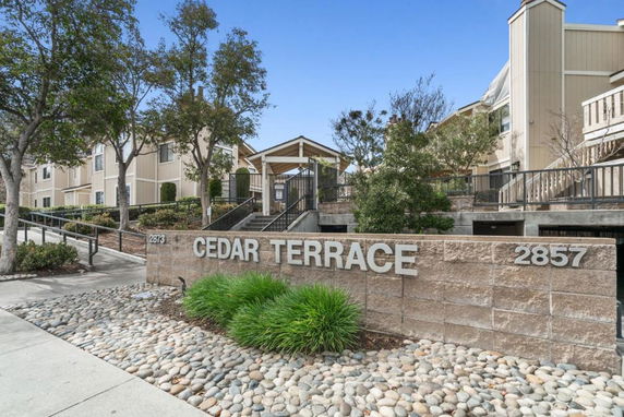 Front view of a building with signage reading 'Cedar Terrace'.