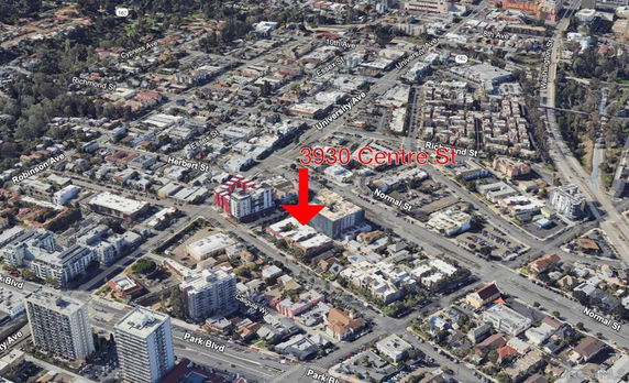 Aerial view of a city area with an arrow pointing to a specific location on Centre Street.