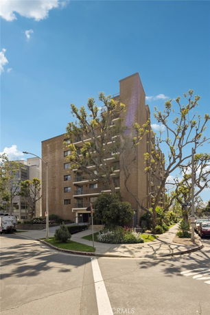 Front view of a multi-story building with balconies.
