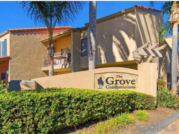 Front view of The Grove Condominiums building entrance.