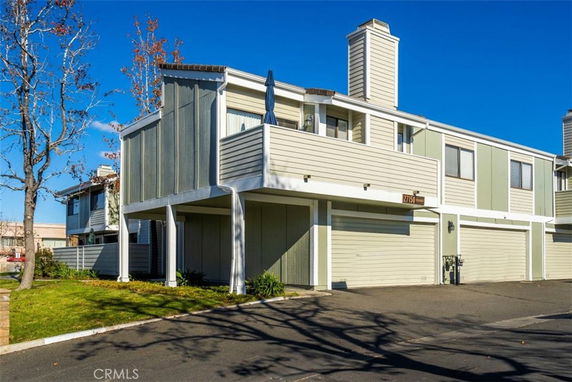 Front view of a two-story building with an attached garage.