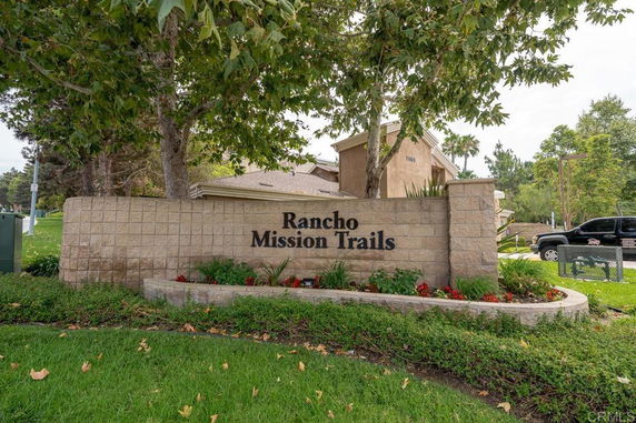 Front view of a building entrance with a name sign at Rancho Mission Trails.