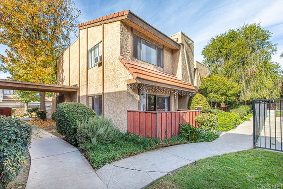 Front view of a two-story house with a covered entrance.