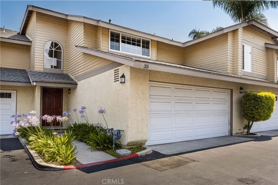 Front view of a two-story house with attached double garage.