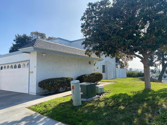 Front view of a single-story house with a garage.