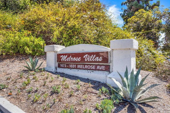Entrance sign for Melrose Villas displaying the address 1673-1691 Melrose Ave.