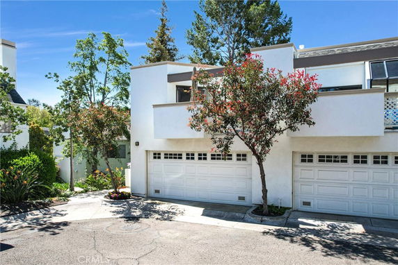 Front view of a modern two-story house with a double garage.