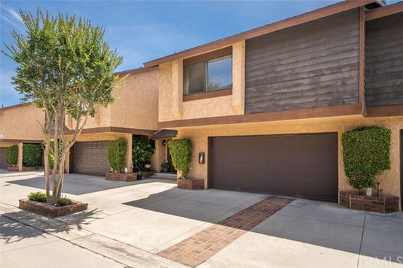 Front view of a two-story house with a double garage.