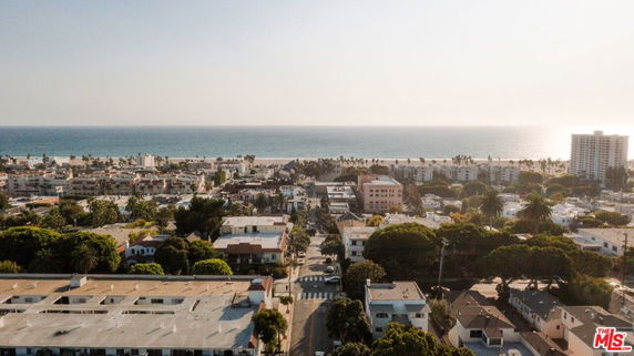 Panoramic view of a coastal urban area with buildings and the ocean in the background.
