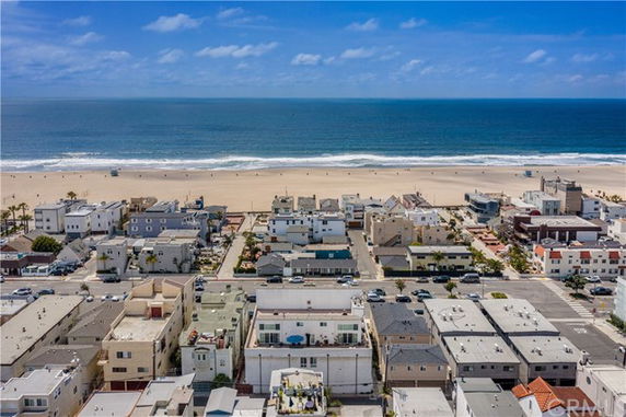 Panoramic view of coastal residential area and beach.