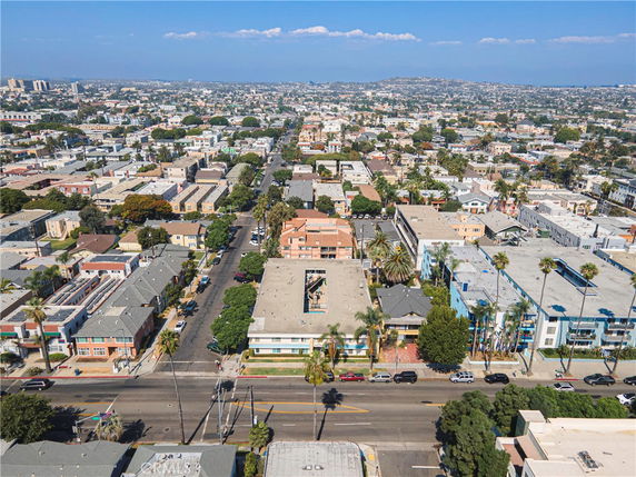 Panoramic view of a cityscape with various buildings and roads.