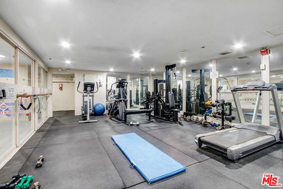 Indoor gym area with various exercise equipment.