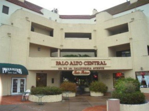 Front view of a multi-story commercial building with signage.