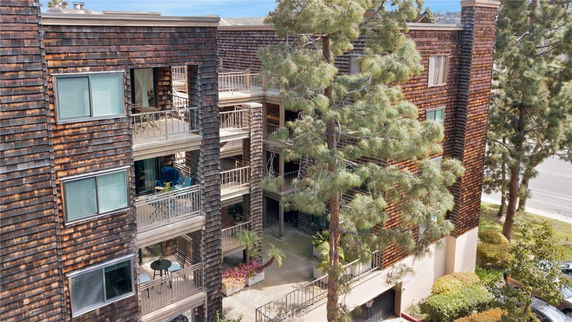 Exterior view of a multi-story apartment building with balconies.