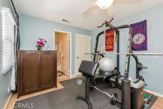 Indoor gym area with exercise equipment.
