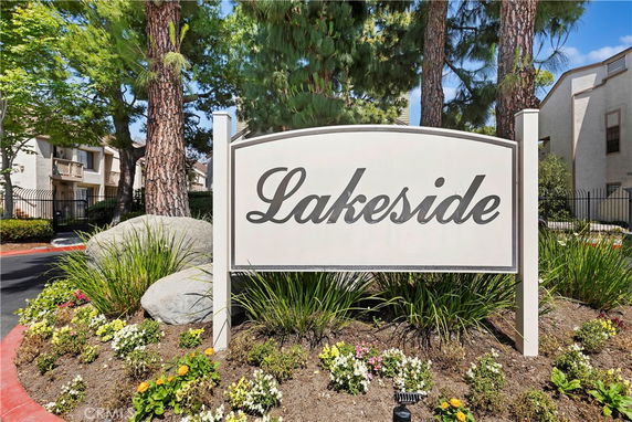 Front view of a residential complex with a sign reading 'Lakeside'.
