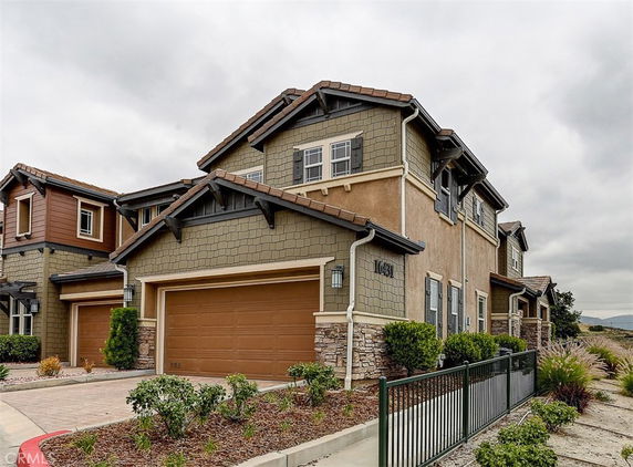 Front view of a two-story house with a double garage.
