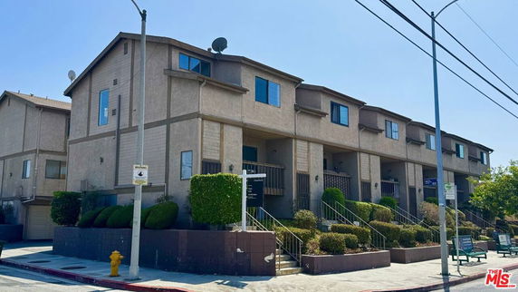 Front view of a multi-story apartment building.