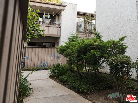Front view of an apartment building with balconies.