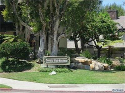 Front view of a residential building with a sign that reads 'Country Club Gardens'.