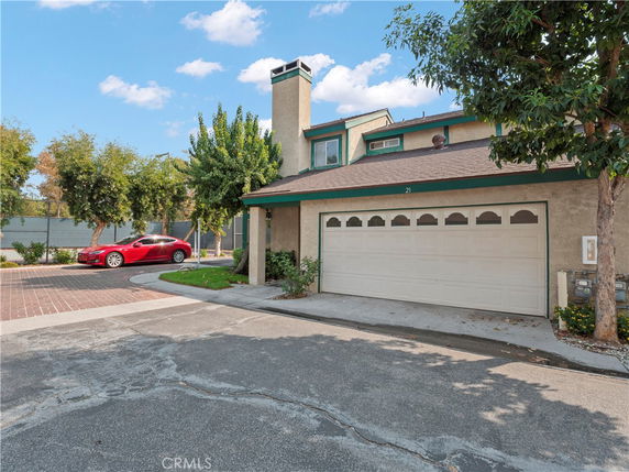 Front view of a two-story house with a double garage.