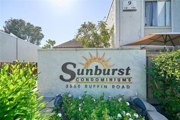 Front view of the Sunburst Condominiums entrance sign.