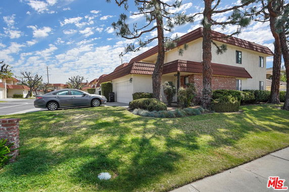 Front view of a two-story house with a garage.
