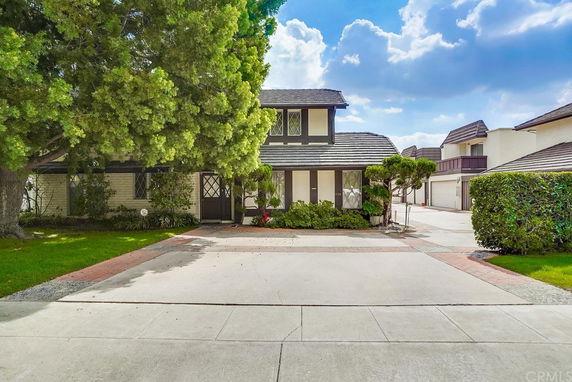 Front view of a two-story house with a driveway.