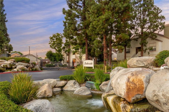 View of the entrance with trees and a sign labeled 'Lakeside.'