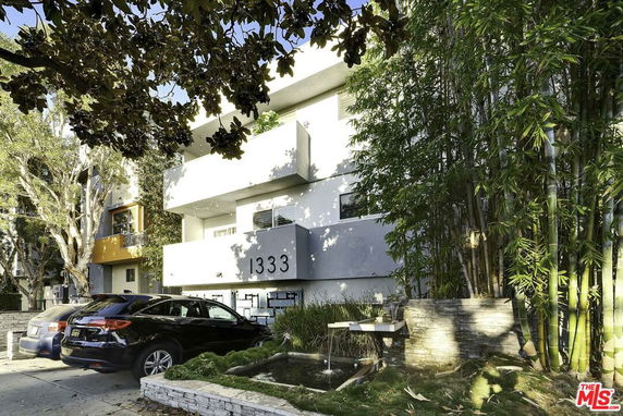 Front view of a multi-story building with a modern design and address number 1333.