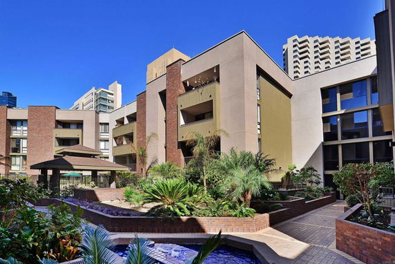 Front view of a multi-story building with a modern design.